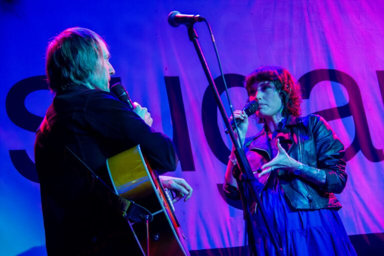 Two people singing